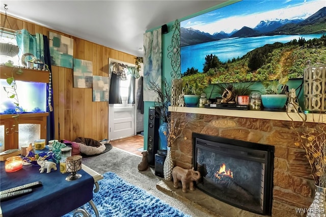 2125 Seneca Ave, Niagara Falls, NY 14305 - living room featuring wooden walls and a stone fireplace