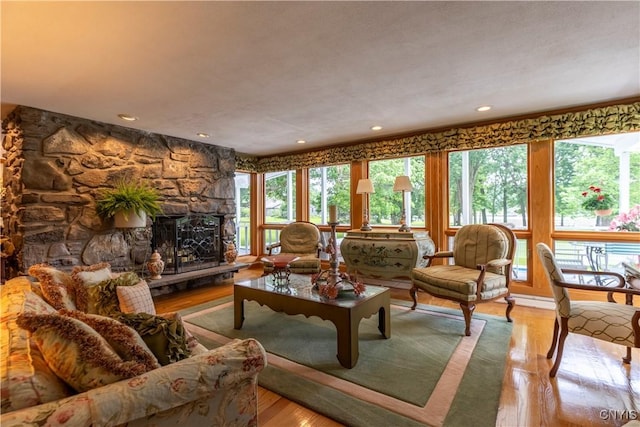 1664 S Ivy, Lysander, NY 13027 - living room featuring plenty of natural light, recessed lighting, wood finished floors, and a fireplace