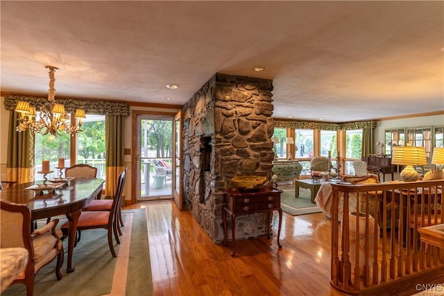 1664 S Ivy, Lysander, NY 13027 - dining area featuring a chandelier, light wood-style flooring, and healthy amount of natural light