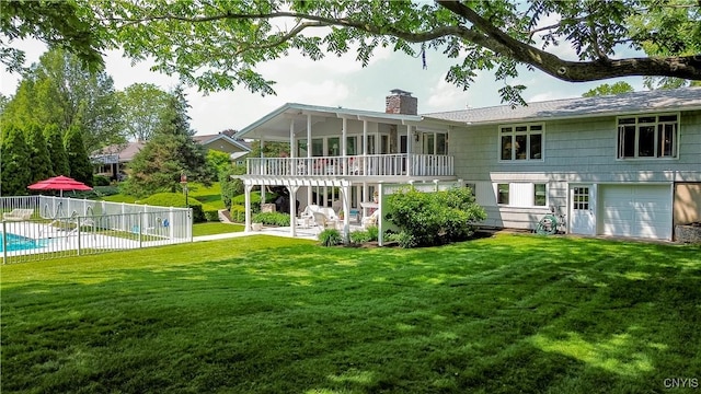 1664 S Ivy, Lysander, NY 13027 - rear view of property featuring a patio area, a chimney, and an attached garage
