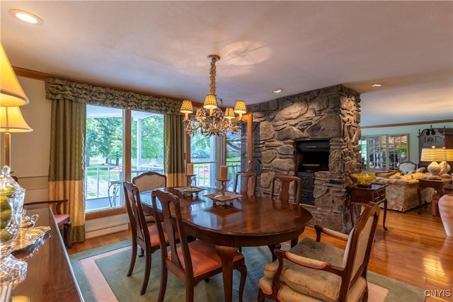 1664 S Ivy, Lysander, NY 13027 - dining area with a chandelier, wood finished floors, ornamental molding, a fireplace, and recessed lighting