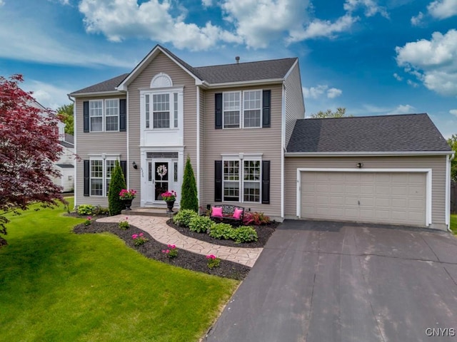 8228 Dampier Cir, Clay, NY 13090 - colonial house with an attached garage, a front lawn, and asphalt driveway