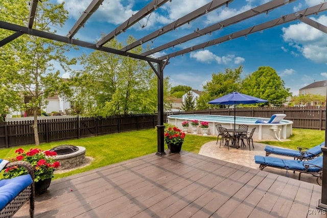 8228 Dampier Cir, Clay, NY 13090 - fenced backyard with an outdoor fire pit, a wooden deck, and a pergola