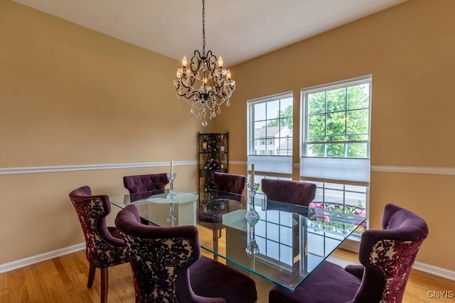 8228 Dampier Cir, Clay, NY 13090 - dining space featuring wood finished floors and a chandelier