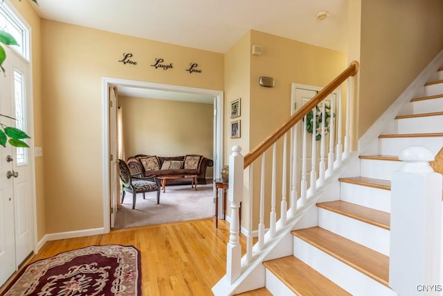8228 Dampier Cir, Clay, NY 13090 - foyer featuring wood finished floors and stairs