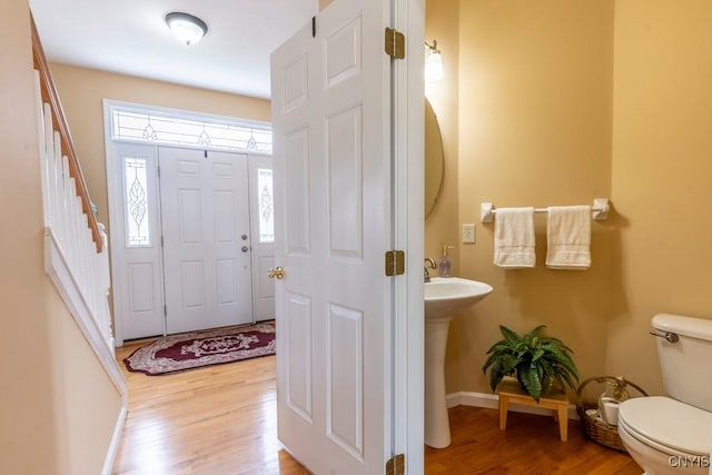 8228 Dampier Cir, Clay, NY 13090 - foyer entrance featuring baseboards and wood finished floors