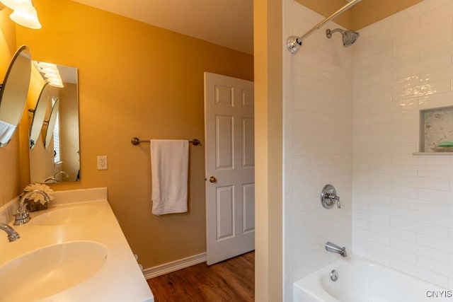 8228 Dampier Cir, Clay, NY 13090 - bathroom featuring shower / tub combination, double vanity, and wood finished floors