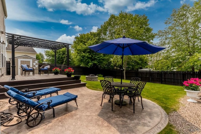 8228 Dampier Cir, Clay, NY 13090 - fenced backyard featuring a fire pit, a storage unit, a pergola, a wooden deck, and outdoor dining space