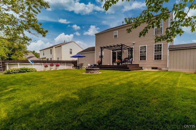 8228 Dampier Cir, Clay, NY 13090 - rear view of house with a fire pit, a pergola, and a deck
