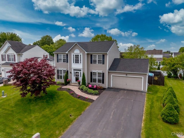 8228 Dampier Cir, Clay, NY 13090 - colonial-style house featuring an attached garage and asphalt driveway