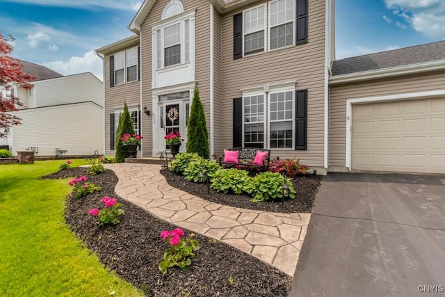 8228 Dampier Cir, Clay, NY 13090 - view of front facade featuring a garage, a front yard, and driveway