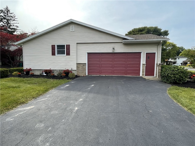 75 Towpath Ln, Brighton, NY 14618 - view of front of property with driveway, a garage, and a front yard