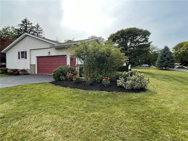 75 Towpath Ln, Brighton, NY 14618 - view of side of home with asphalt driveway, a yard, and an attached garage