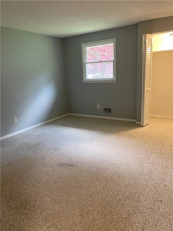 75 Towpath Ln, Brighton, NY 14618 - carpeted empty room featuring baseboards