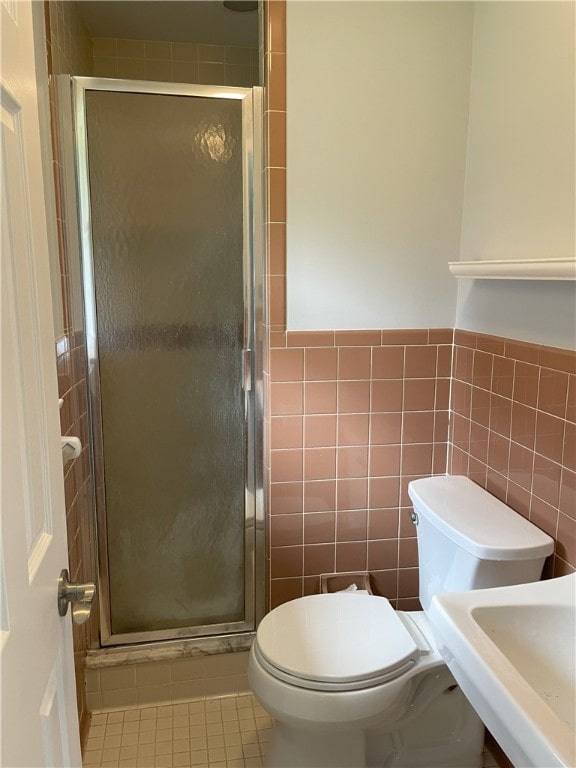 75 Towpath Ln, Brighton, NY 14618 - full bath with tile walls, a shower stall, tile patterned flooring, and wainscoting
