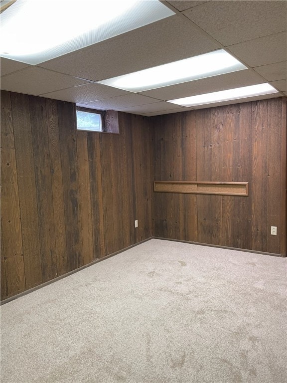 75 Towpath Ln, Brighton, NY 14618 - below grade area with a drop ceiling, carpet flooring, and wood walls
