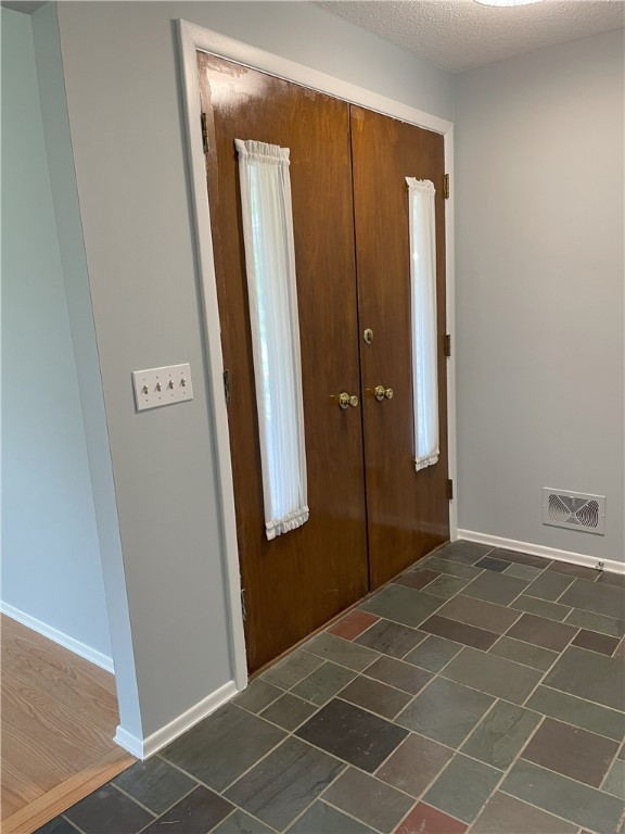 75 Towpath Ln, Brighton, NY 14618 - entryway with baseboards
