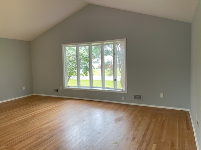 75 Towpath Ln, Brighton, NY 14618 - unfurnished room featuring lofted ceiling and wood finished floors