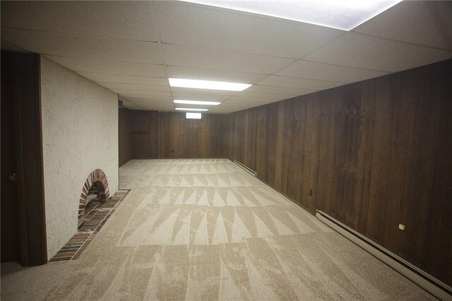 75 Towpath Ln, Brighton, NY 14618 - finished basement with light carpet, baseboard heating, wooden walls, and a drop ceiling