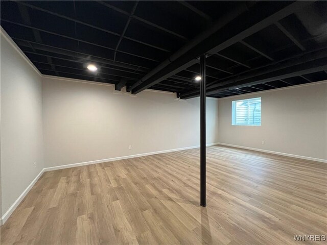 122 Winterbrook Dr, Amherst, NY 14228 - below grade area with light wood-style flooring and baseboards