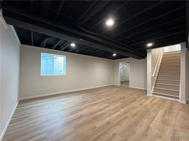 122 Winterbrook Dr, Amherst, NY 14228 - below grade area with wood finished floors and stairway