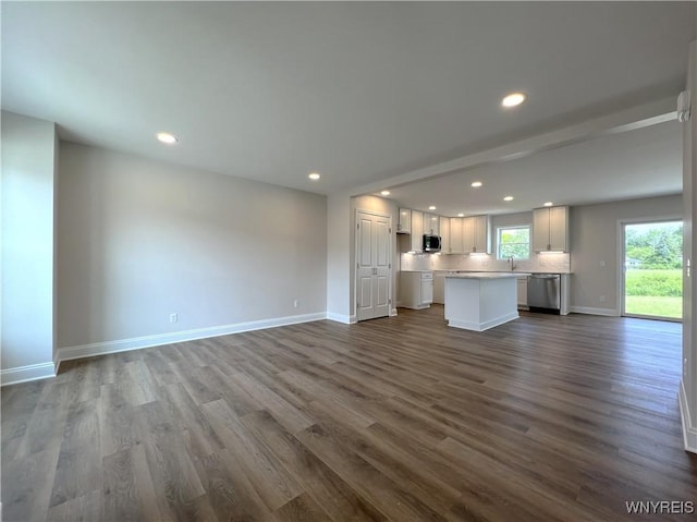 122 Winterbrook Dr, Amherst, NY 14228 - unfurnished living room featuring recessed lighting and dark wood-type flooring