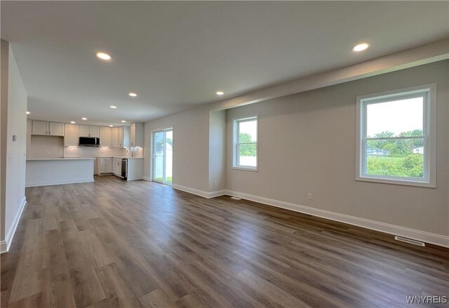 122 Winterbrook Dr, Amherst, NY 14228 - unfurnished living room with recessed lighting and dark wood finished floors