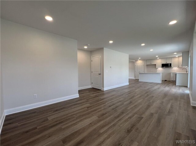 122 Winterbrook Dr, Amherst, NY 14228 - unfurnished living room with recessed lighting and dark wood-style flooring