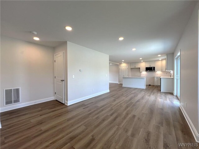 122 Winterbrook Dr, Amherst, NY 14228 - unfurnished living room with dark wood-type flooring and recessed lighting