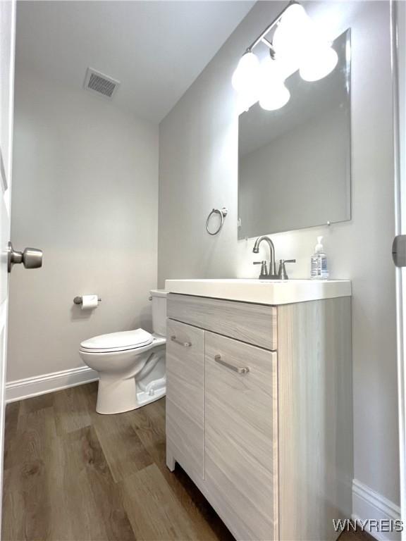 122 Winterbrook Dr, Amherst, NY 14228 - bathroom with wood finished floors and vanity