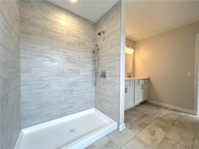 122 Winterbrook Dr, Amherst, NY 14228 - full bathroom with vanity, a tile shower, and tile patterned flooring