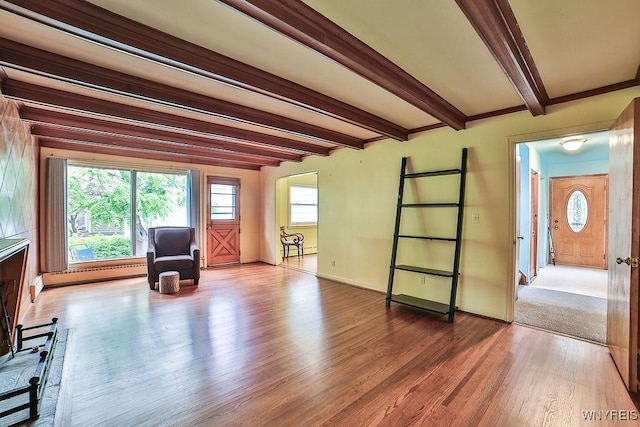 425 Tryon Dr, Lewiston, NY 14092 - living area with wood finished floors, beam ceiling, baseboard heating, and healthy amount of natural light