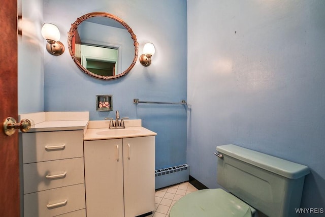 425 Tryon Dr, Lewiston, NY 14092 - bathroom with baseboard heating, vanity, and tile patterned floors