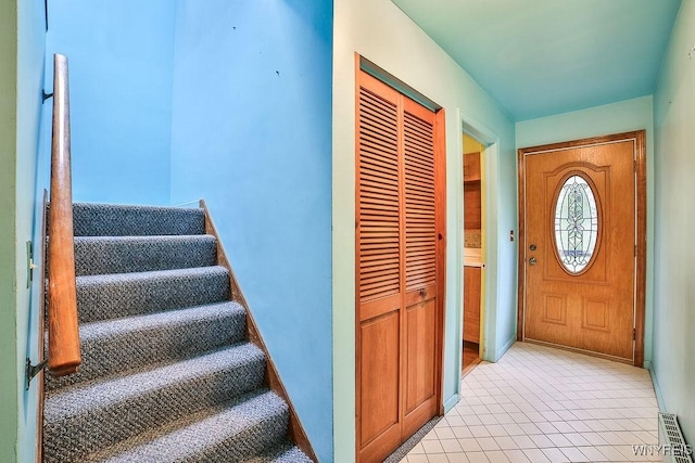 425 Tryon Dr, Lewiston, NY 14092 - entrance foyer featuring stairs and baseboards