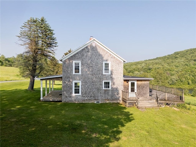 1870 Carey Rd, Franklin, NY 13775 - back of property with a wooden deck, a yard, and a view of trees