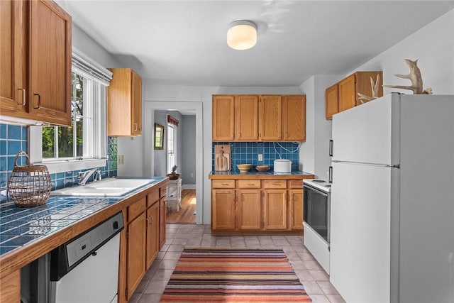 1870 Carey Rd, Franklin, NY 13775 - kitchen with white appliances, tile counters, tasteful backsplash, and light tile patterned floors