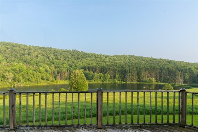 1870 Carey Rd, Franklin, NY 13775 - deck featuring a wooded view, a water view, and a lawn