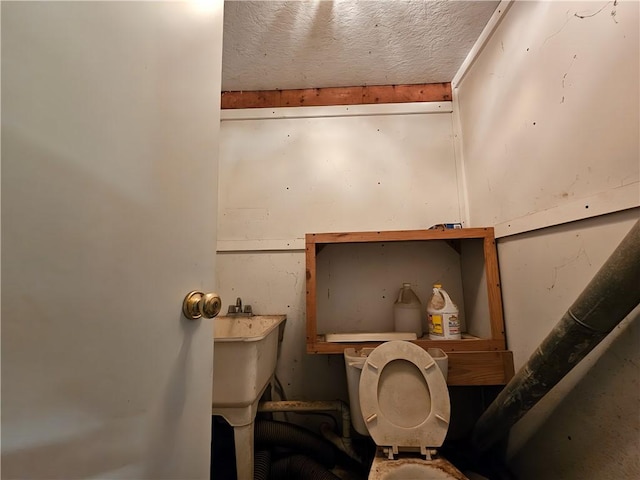 2313 Stickle Rd, Addison, NY 14801 - bathroom featuring toilet and a textured ceiling