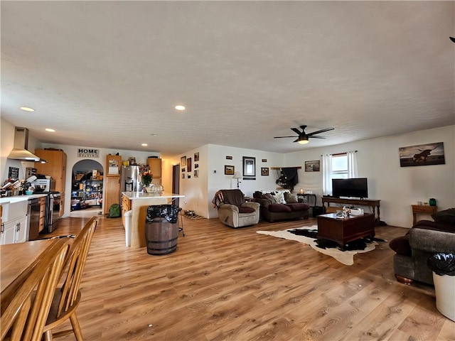 2313 Stickle Rd, Addison, NY 14801 - living room with a ceiling fan, light wood-style floors, arched walkways, and recessed lighting