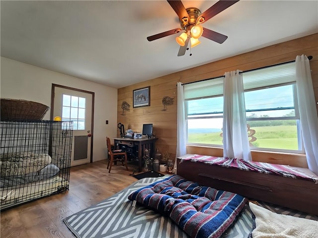 2313 Stickle Rd, Addison, NY 14801 - bedroom featuring wood finished floors, wooden walls, and ceiling fan