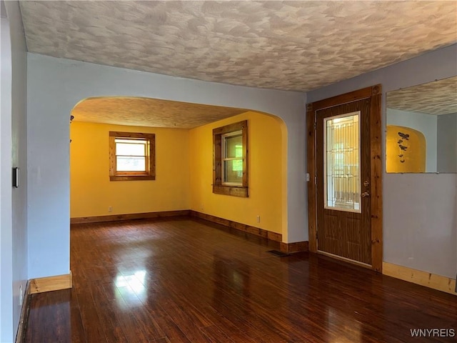 11052 S Lake Rd, Pavilion, NY 14525 - entryway with arched walkways, a textured ceiling, and hardwood / wood-style floors