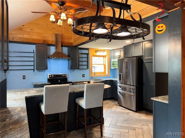 11052 S Lake Rd, Pavilion, NY 14525 - kitchen featuring stainless steel fridge, wall chimney exhaust hood, electric stove, gray cabinetry, and ceiling fan