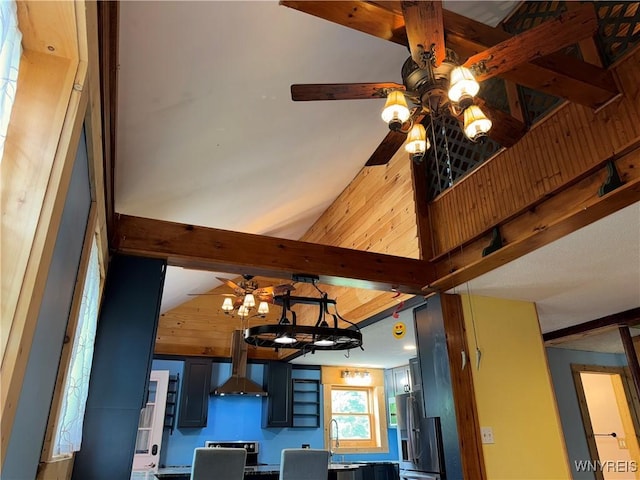 11052 S Lake Rd, Pavilion, NY 14525 - detailed view of freestanding refrigerator, ceiling fan, beam ceiling, wall chimney range hood, and range