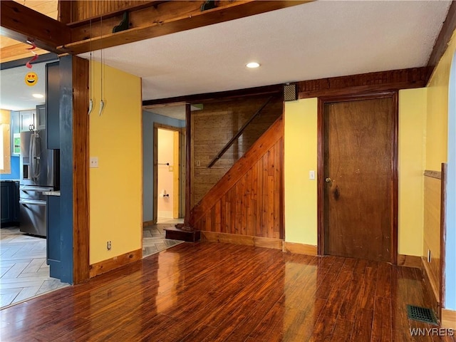 11052 S Lake Rd, Pavilion, NY 14525 - unfurnished living room with wood finished floors, wooden walls, stairway, recessed lighting, and a barn door
