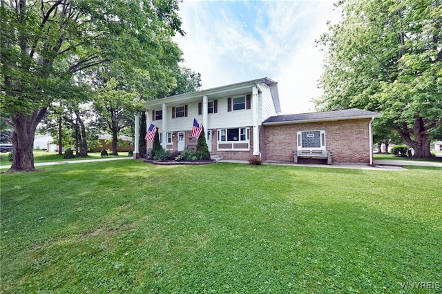 6193 New Taylor Rd, Orchard Park, NY 14127 - bi-level home with a front lawn and brick siding