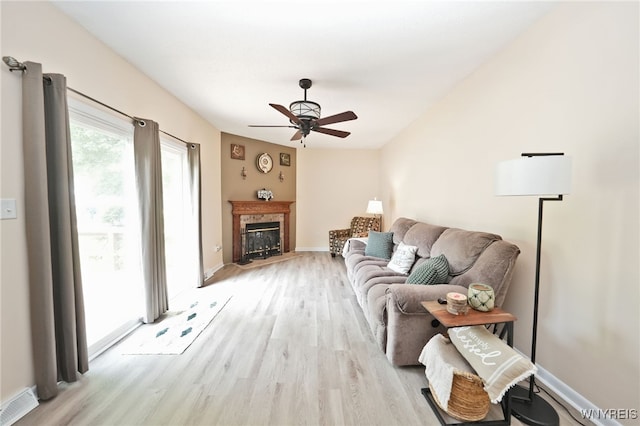 6193 New Taylor Rd, Orchard Park, NY 14127 - living room with a ceiling fan, light wood-style flooring, and a glass covered fireplace