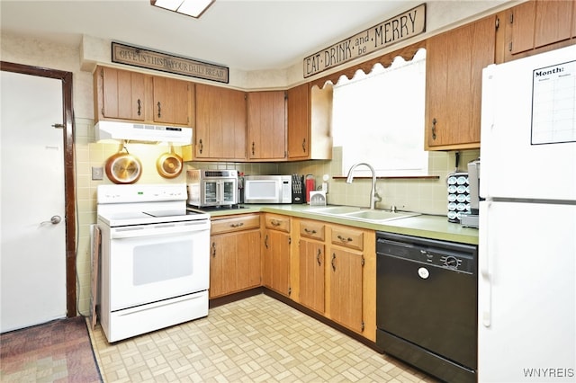 6193 New Taylor Rd, Orchard Park, NY 14127 - kitchen featuring white appliances, under cabinet range hood, decorative backsplash, light countertops, and brown cabinets