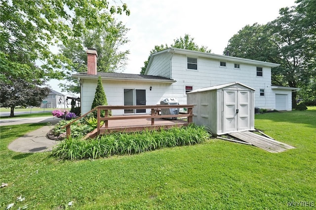 6193 New Taylor Rd, Orchard Park, NY 14127 - rear view of property featuring a storage shed, a lawn, a chimney, and a deck
