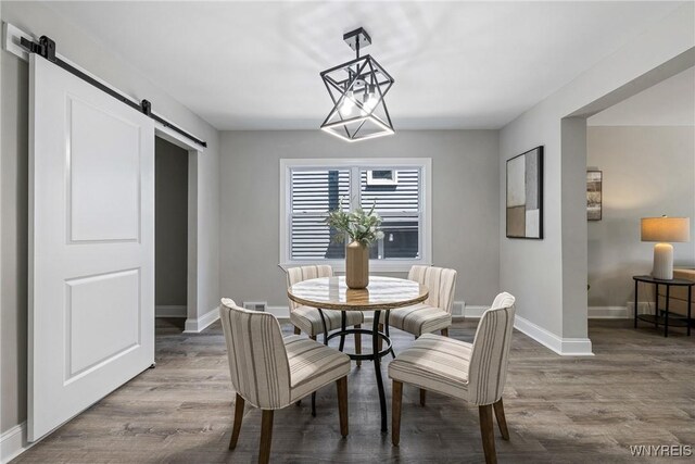 362 W Delavan Ave Unit N, Buffalo, NY 14213 - dining space featuring a barn door and wood finished floors