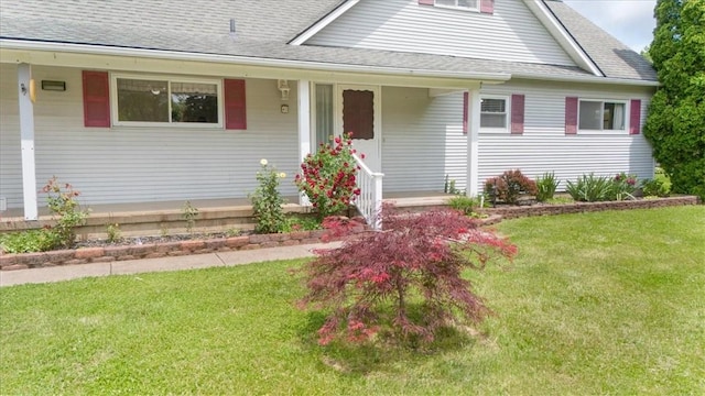 40 Colleen, Henrietta, NY 14534 - view of front of home featuring a front yard, a shingled roof, and a porch